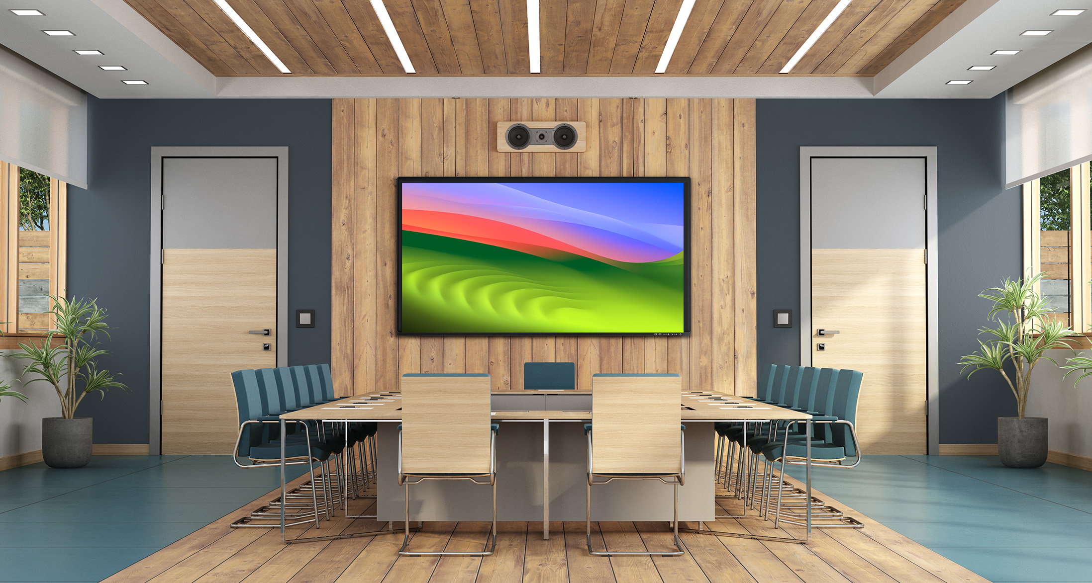 Modern conference room with large wall-mounted display, video conferencing camera, and seating for business meetings in Palm Beach County